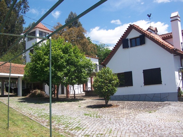 Two views of the cobbled area in front of the main villa